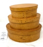 Set of three nesting wooden oval boxes