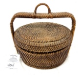 Antique woven basket with handle