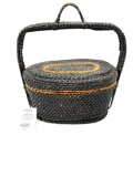 Antique black woven basket with handle
