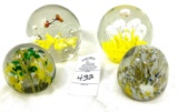 Four vintage paper weights