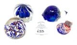 Four vintage paperweights