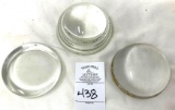 Three clear glass paperweights