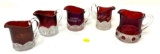 Five antique red glass souvenir creamers