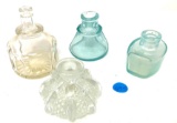 Four vintage clear and blue glass inkwells
