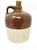 Antique brown and white crock jug