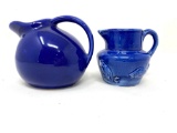 Two vintage blue creamers