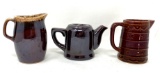 Brown vintage creamers and tea pot