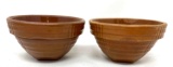Two antique brown crock bowls