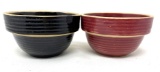 Two antique USA black and cranberry crock bowls