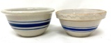 Two antique crock bowls with blue lines