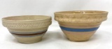 Two antique crock bowls with blue, brown and pink lines