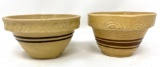 Two antique crock bowls with brown lines