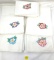 Five embroidered vintage dish towels