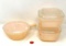 Two fire king refrigerator dishes and one bowl with handle