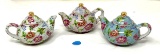 Three vintage tea pots with flowers