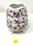 Vintage vase with purple flowers