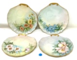 Four antique decorated tea plates with gold edge