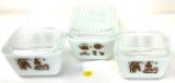 Three vintage Pyrex refrigerator dishes with lids