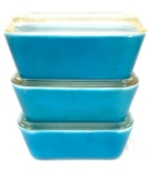 Three vintage Pyrex 502 blue refrigerator dishes with lids