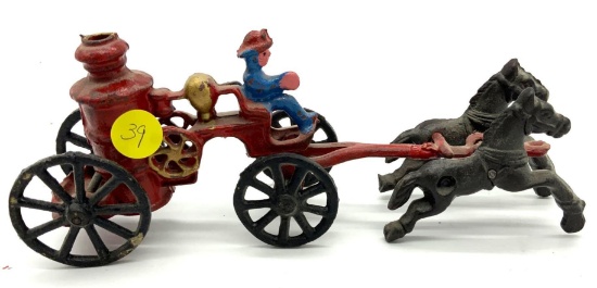 Antique cast iron horse drawn fire wagon