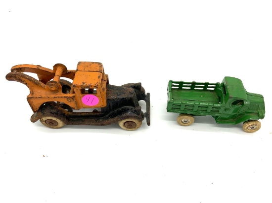 Two antique cast iron trucks