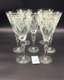 Seven vintage etched glass wine glasses