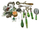 Antique cookie cutters and green handled kitchen utensils