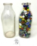 Antique milk jars, one with marbles