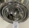 Set of metal mixing bowls and measuring cups
