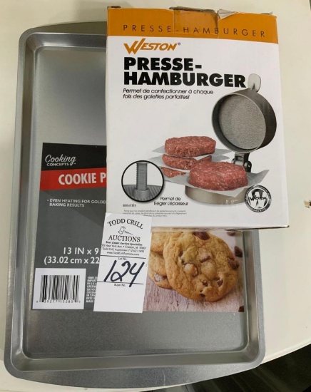 Two cookie trays and hamburger press