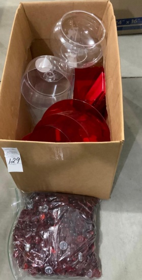 Clear and red plastic dishes and red glass pieces