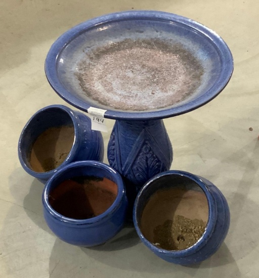 Blue birdbath and planters