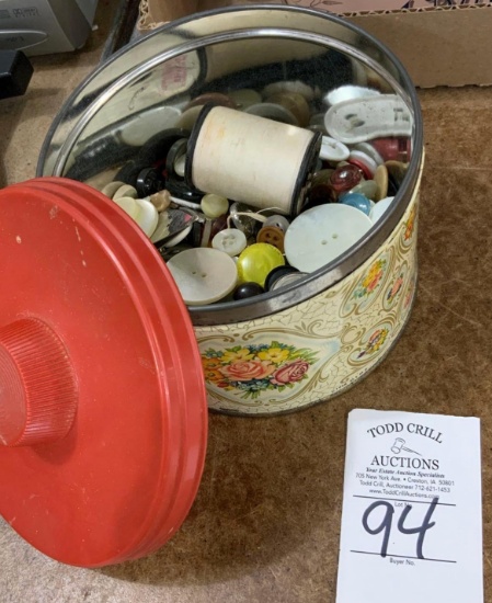 Tin with buttons