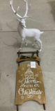 White deer and holiday sled