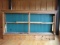 H.E. WITTEN ANTIQUE WOODEN DISPLAY CASE, APPROX 10' WIDE. 