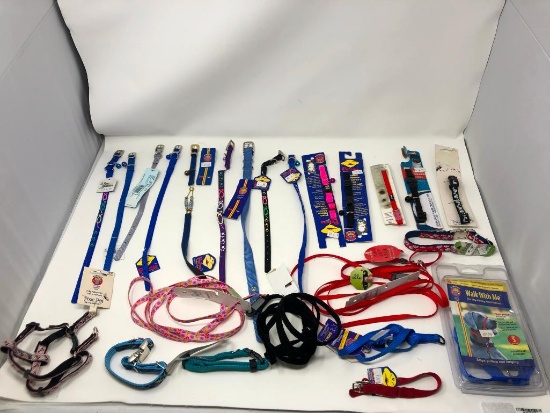 24, assorted leashes, collars, and harnesses