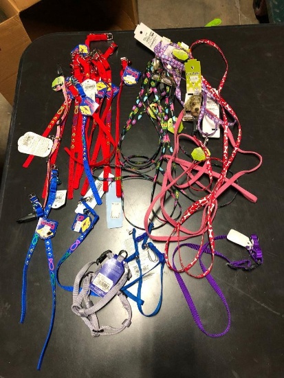 25, assorted leashes, collars, and harnesses