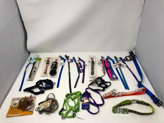 23, assorted leashes, collars, and harnesses, chew toy