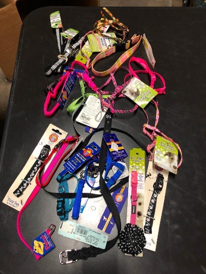 25, assorted leashes, collars, and harnesses