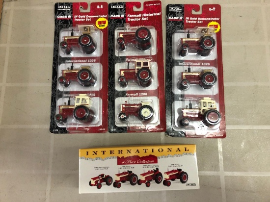 Box lot of international 1/64 scale Diecast tractors
