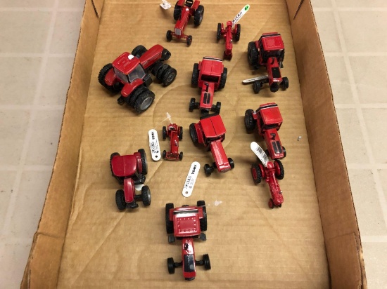 Box lot of international diecast 1/64 scale tractors