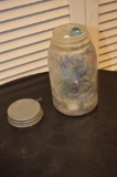 Dray fruit jar full of large marbles