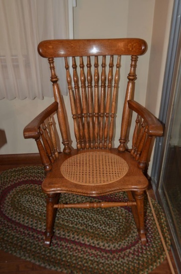 Antique rocking chair with cane bottom