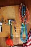 Contents of peg board in garage as pictured