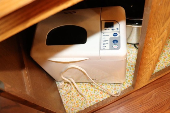 Contents of Cabinet including Breadmaker pots and pans etc.