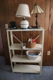 Metal Shelf with contents including lamps, radios, and cassette player