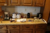 Contents of Counter including Coffee pot, toaster, cutting board etc.