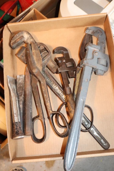 Flat of tools including pipe wrenches, chistles and tin cutters