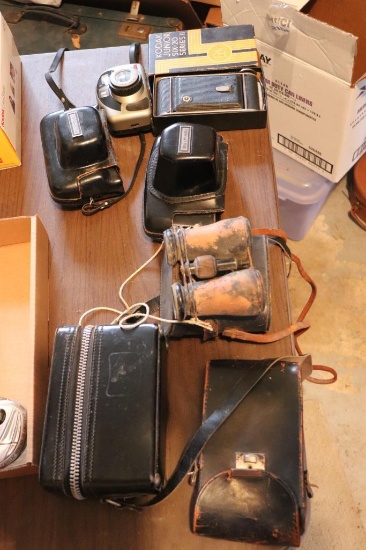 Lot of old binoculars and cameras