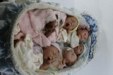 Baby Crib and Assorted Dolls
